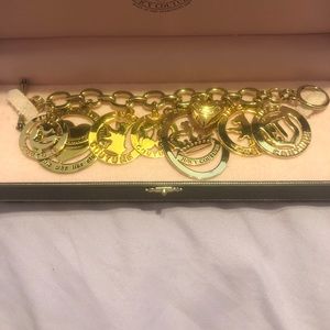 Juicy Couture new in box gold tone charm bracelet